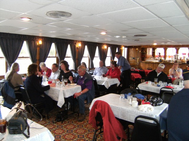 Various Department members sitting enjoying dessert.